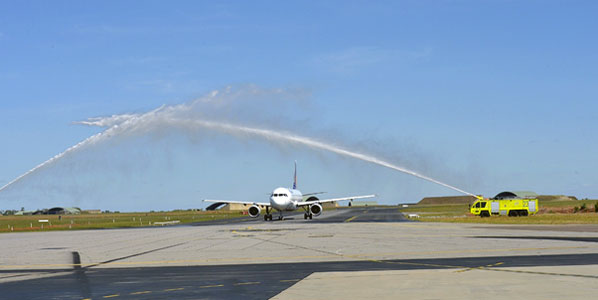 Darwin, where one of the airline’s A320s receives the new route water-arch treatment.