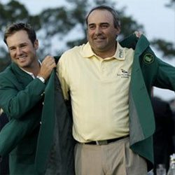 Image: Angel Cabrera receives the famous green jacket after winning the Masters
