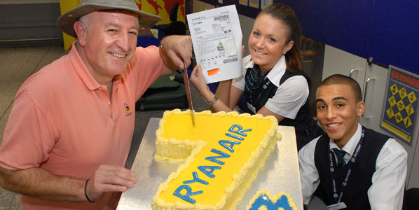 Ryanair celebrated reaching 7 million passengers at Bristol Airport. Angelo Tebano from Southampton, who was travelling to Dublin, was the lucky passenger who received a pair of return tickets to Katowice. He is here seen given the honour of cutting the celebratory cake, assisted by Paris Spokes and Martin Msara of Servisair.