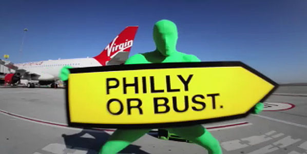 The mysterious ‘Greenman’ from the FX television show “It’s Always Sunny in Philadelphia.” near a Virgin America aircraft.