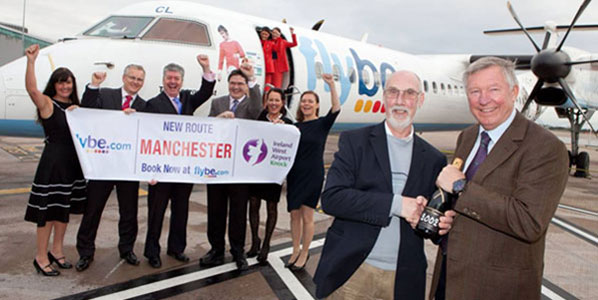 Sir Alex Ferguson (coach of a minor league football team) welcomes the first passenger on Flybe’s 4 x weekly Knock-Manchester route.