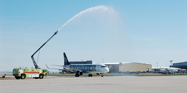 Frontier’s first flight from Denver was welcomed with a water cannon salute.