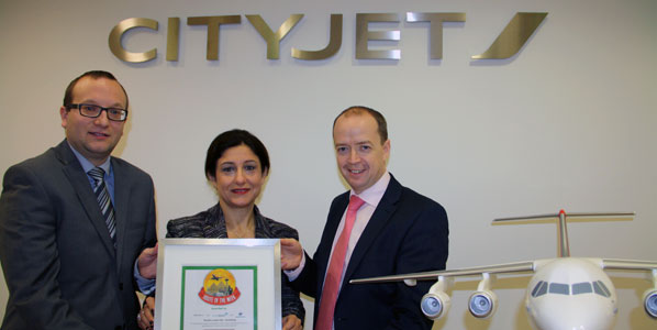 Christine Ourmières (centre), CityJet boss is proud to pose with its latest - none other than anna.aero's prestigious Route of the Week certificate.