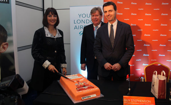 Eagerly awaiting a chance to try the amazing Moscow-themed cake are Simon Burns, Minister of State for Transport (centre), and Guy Stephenson, Chief Commercial Officer, London Gatwick Airport (right).