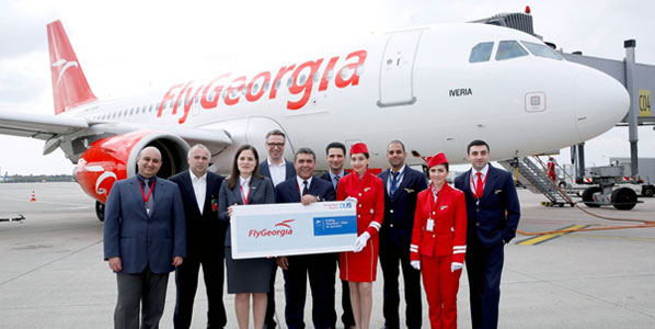 Holding the banner for the new Tbilisi to Düsseldorf route are: John Kohlsaat, CEO at FlyGeorgia; Antonio Di Monaco, Düsseldorf Airport Airline Manager and FlyGeorgia crew.