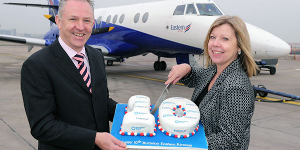 Ready to cut the cake are Martyn Lloyd, Birmingham Airport’s Commercial Director (left) and Kay Ryan, Eastern Airways’ Commercial Director. 