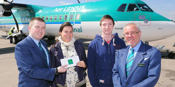 Aer Lingus Regional Cabin Crew, Nick Beggs and Jim McCormack, celebrated with first passengers on their inaugural flight to Birmingham
