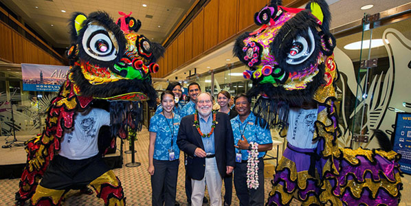 In the centre of the picture is Hawaii Governor Neil Abercrombie, who was one of several VIPs on the inaugural flight to Taipei.