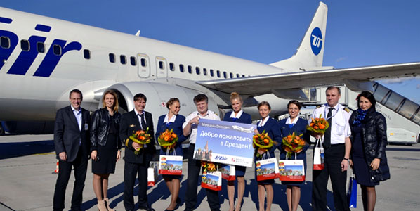 Celebrating the arrival of UTair’s twice-weekly Moscow Domodedovo to Dresden service with the aircraft’s crew were: Dr. Michael Hupe, MD Dresden Airport (left); and Natalya Nikolaeva, UTair Head of Promotion (right).