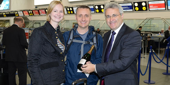 The nine millionth passenger(s) to pass through Birmingham; Andrea Buchner and Jonathan Gumz were presented with a celebratory bottle of champagne by Birmingham Airport CEO, Paul Kehoe