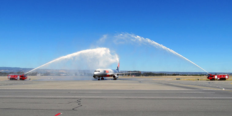 Jetstar Airways kicked-off its own services between Adelaide and Auckland with a traditional water cannon salute.