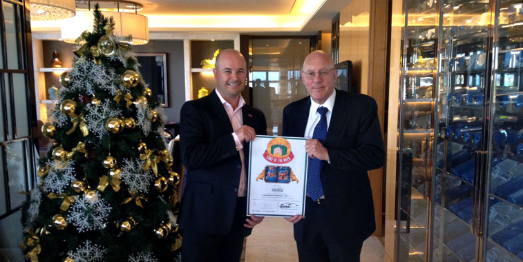 Matthew Findlay, GM Aeronautical Business Development; and Jim Boult, CEO of Christchurch Airport show off their recent Cake of the Week certificate.