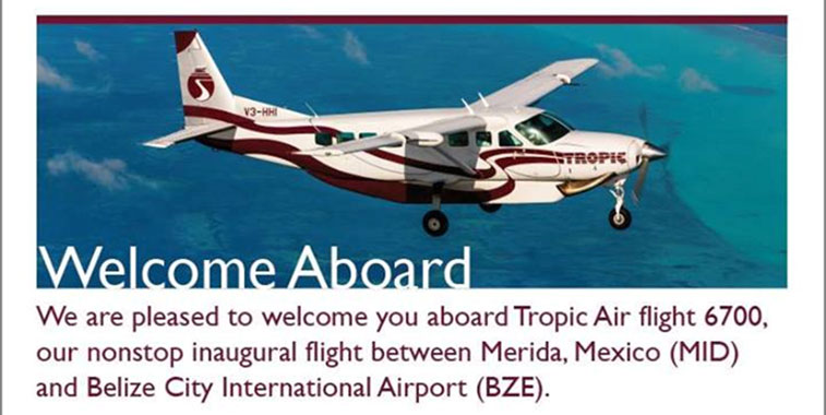 A poster welcoming passengers on board an Tropic Air flight.