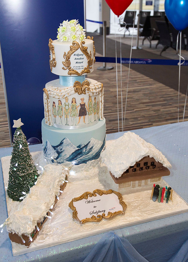 British Airways launched its only international route from Glasgow on 12 December when it commenced a weekly service to Salzburg. The cake was made by a local lady, Susan McInnes, who lives very close to the airport and runs her business by the name of "The Sweetest Thing". The cake is a three-tiered creation, with each tier representing a different element of Salzburg as a visitor destination. The bottom tier depicts skiing, with chalets, skis, snowboards etc (the chalets have working lights inside and out and the Christmas tree also lights up). The second tier is themed on the Sound of Music, with the Von Trapp family featured around the edge. The top tier has a Mozart theme, including quotes from the composer. Each tier also has a different flavour, culminating in the apple strudel on top.