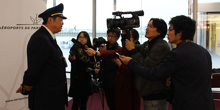 The media sweep to the inaugural captain to get his views and opinions of what it was like to help bring the inaugural flight from Chengdu to Paris. 