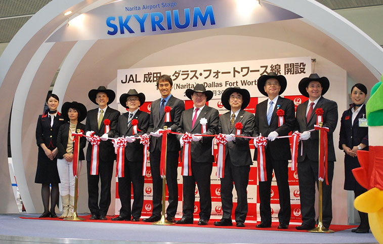 At Tokyo Narita Airport there was a traditional ribbon-cutting ceremony featuring less traditional (at least in Japan) Texas cowboy hats. The one person to keep his head uncovered is Japanese film star Hiroshi Abe who is a brand ambassador for Japan Airlines.