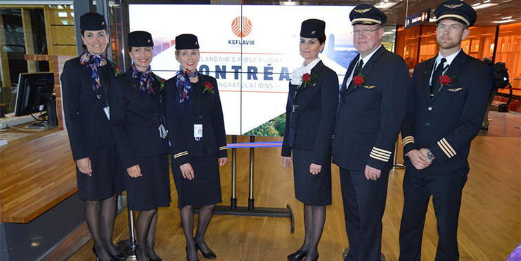 The Icelandair crew of the inaugural flight from Keflavik/Reykjavik to Montreal pose at Gate D21 for a commemorative photo with their special button-hole flowers