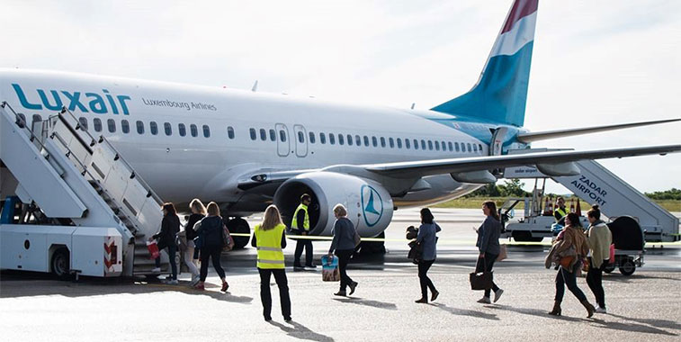 Passengers board the first return service from Zadar to Luxembourg on 2 May